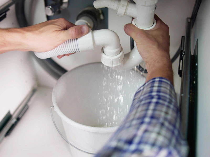 plumber fixing pipe leak